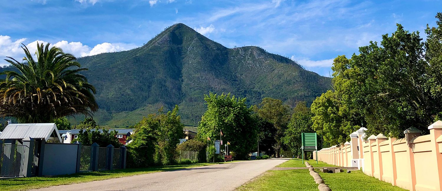 Vibrant Storms River Village Street with the mountain in the background