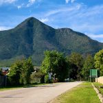 Vibrant Storms River Village Street with the mountain in the background