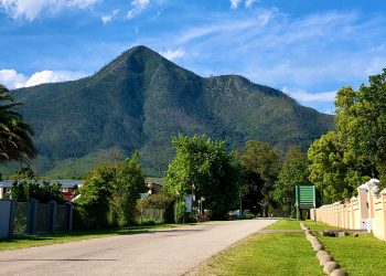 Vibrant Storms River Village Street with the mountain in the background